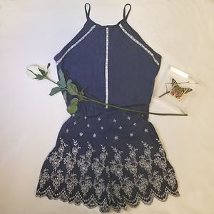 Navy blue romper with white floral detail